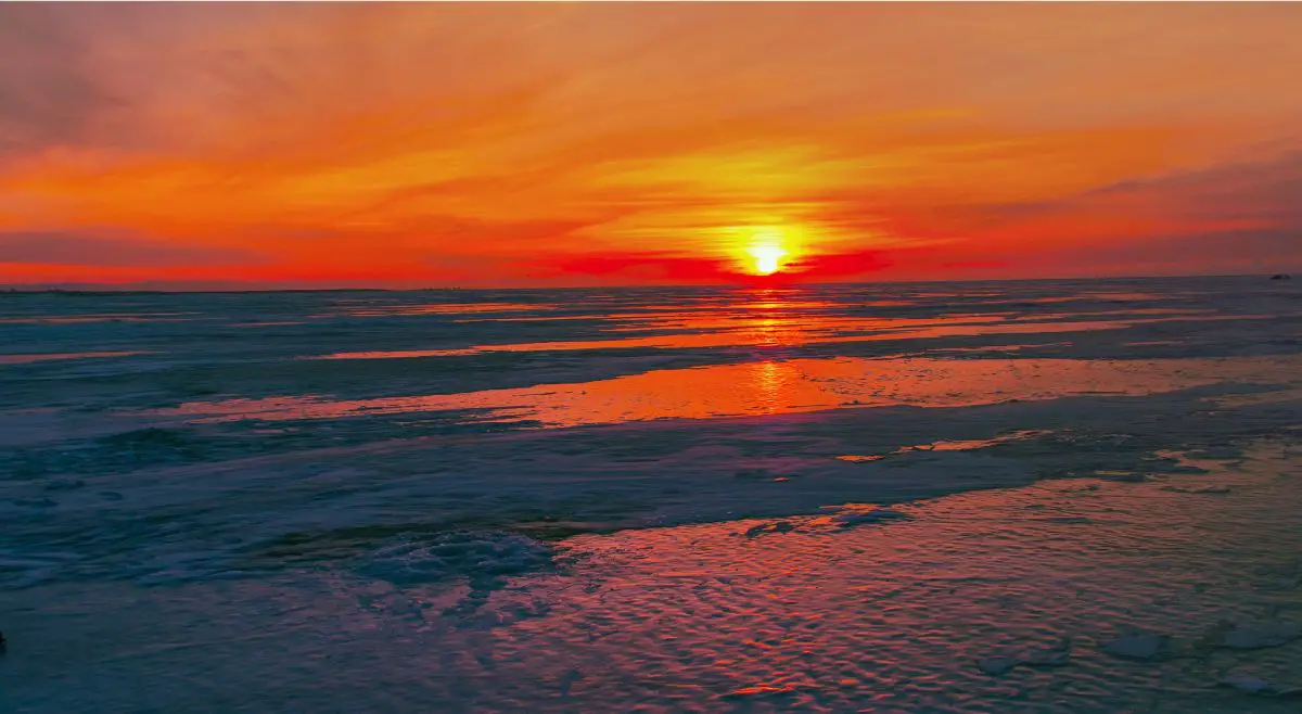 sunset-on-lake-ice - Walking on Clear Ice