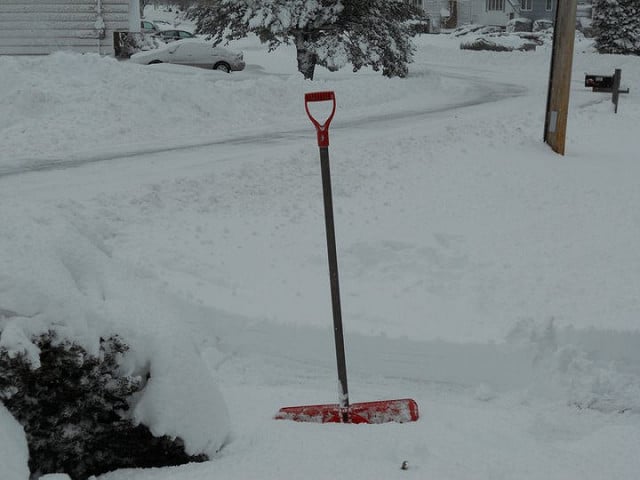 Snow Shovel in the Snow - Cold Weather Emergency
