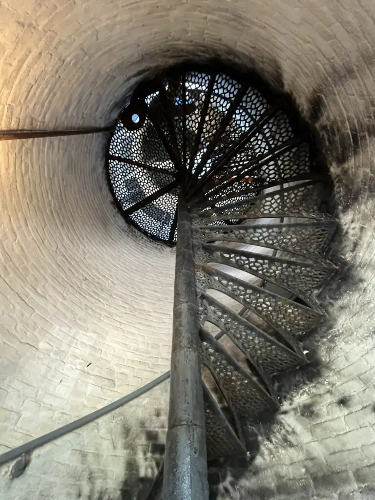 a spiral staircase in a brick tower