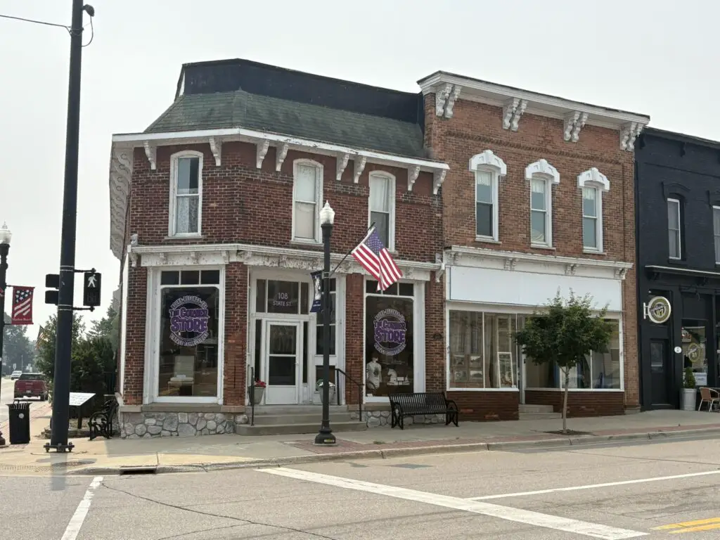 a brick building with a flag on the front