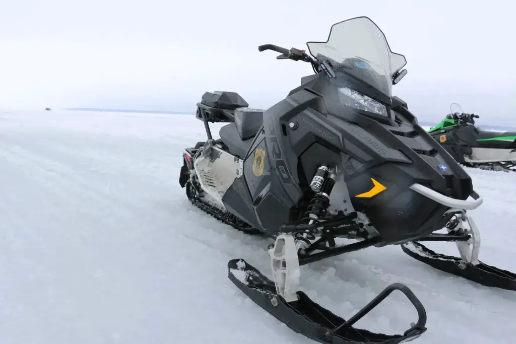 Snowmobile Though Ice