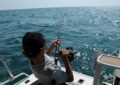 photo of man fishing