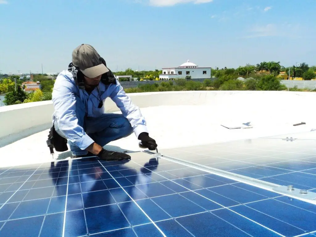 Worker Installing Solar Panels