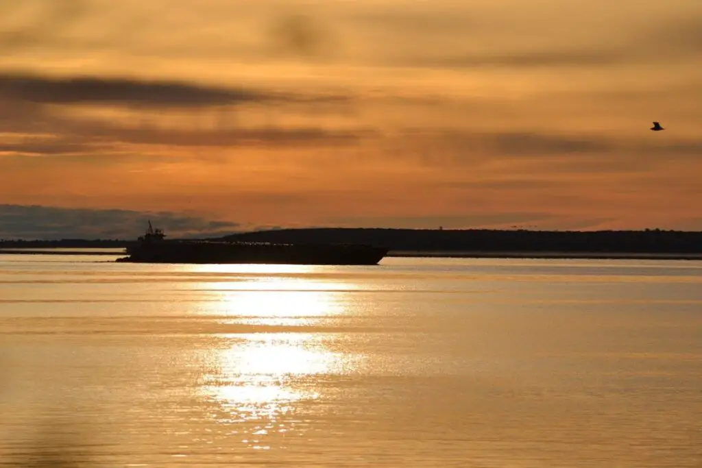 Silhouette of a ship at sunset.