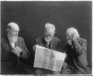 Three old men reading news