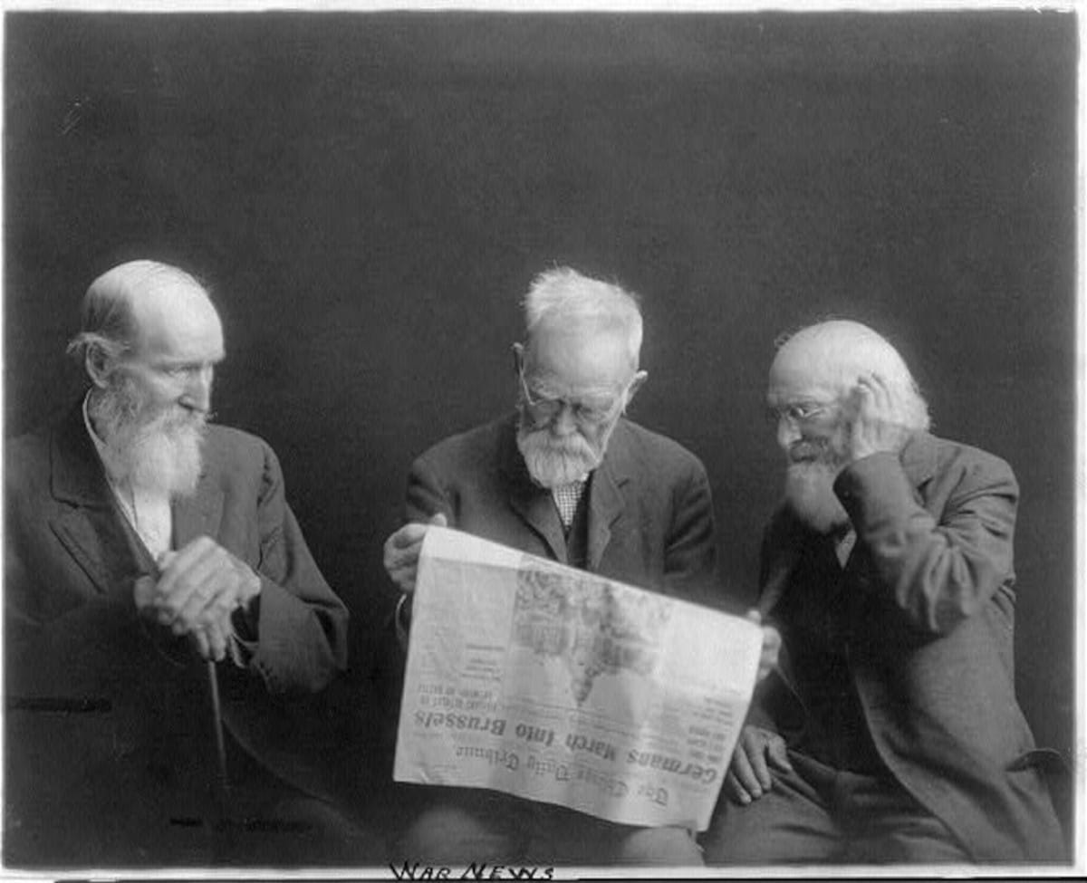 Three old men reading news