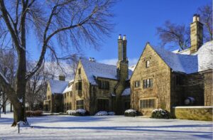a large brick house with snow on the ground