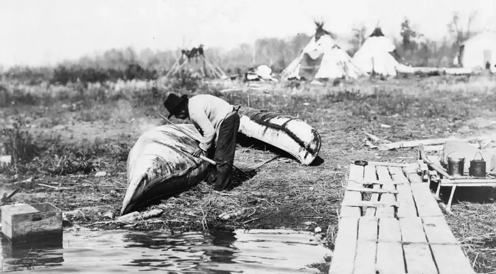 Ojibwa Man Repairing Canoe - Anishinaabeg History