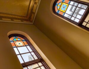 These stained glass windows grace Kirkbride Hall inside Building 50 at The Village at Grand Traverse Commons