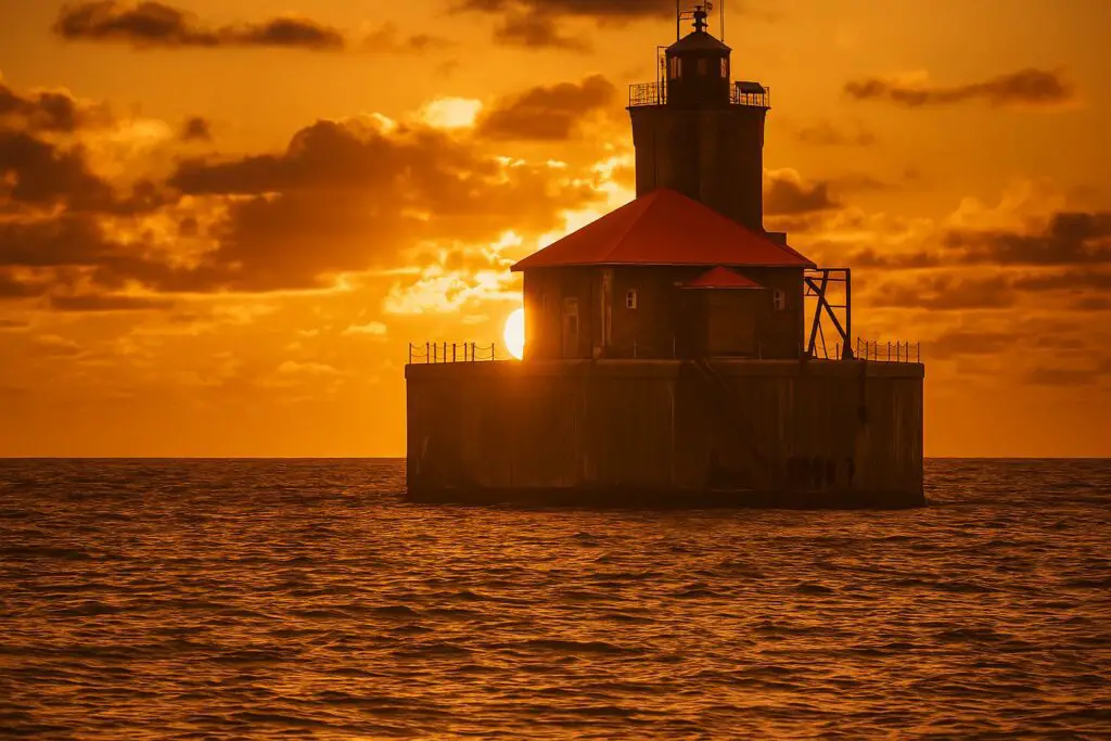 a lighthouse on a small island in the ocean