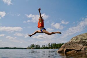 A woman enjoying affordable summer fun at a national park