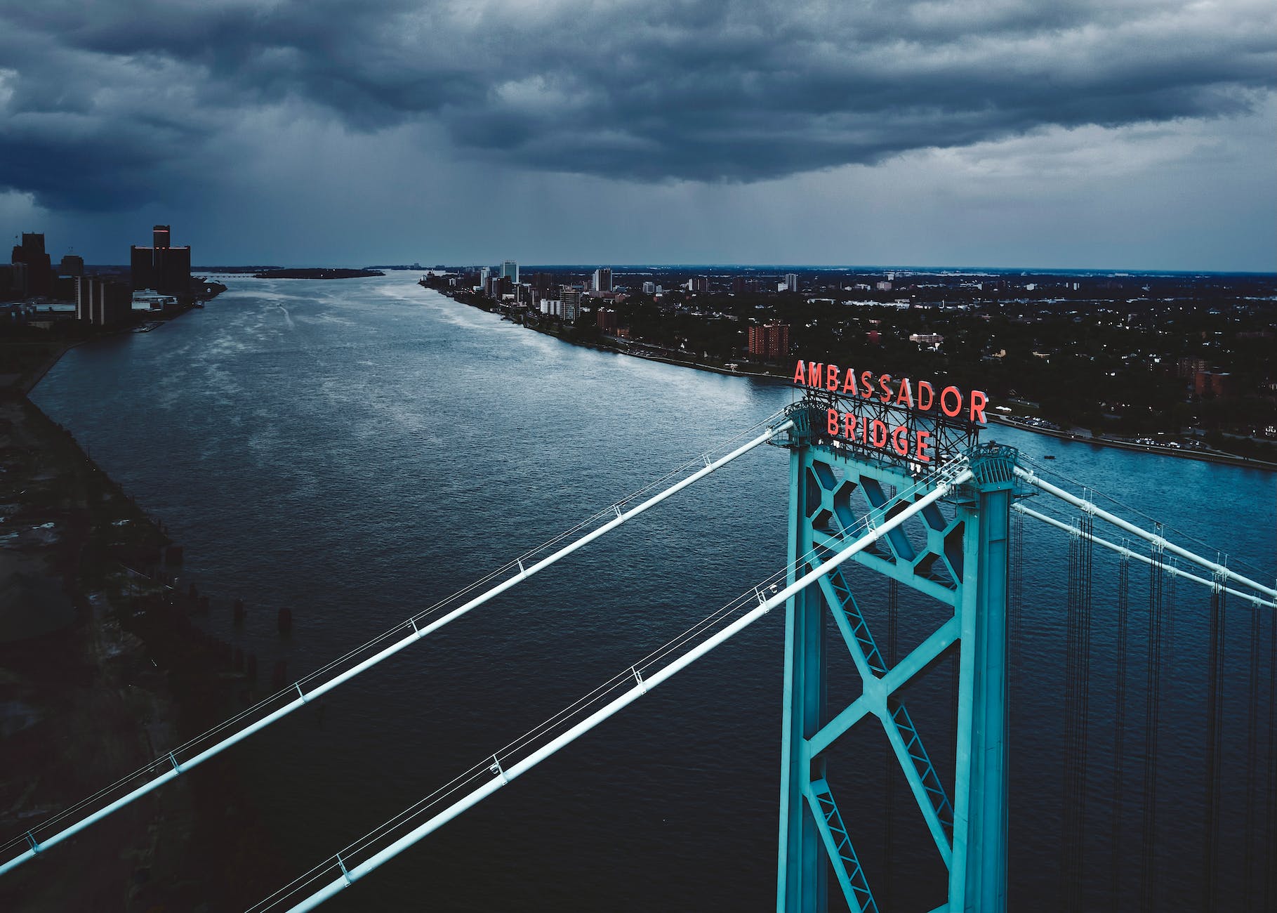 drone shot of the ambassador bridge over the detroit river