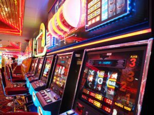 Michigan Slot Venues: A traveler spinning the slot machine with a scenic Michigan landscape in the background.