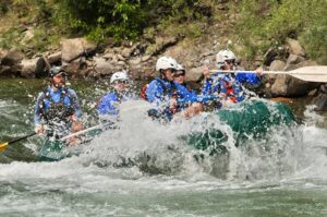 Michigan Whitewater Rafting group navigating rapids