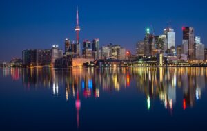 buildings near body of water at night