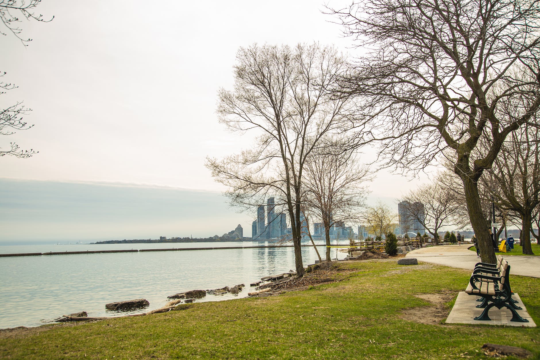 calm park on river shore with view of contemporary city skyscrapers - Michigan Slot venues