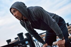 Man wearing a Custom Hoodies Michigan design, showcasing fabric and print quality.