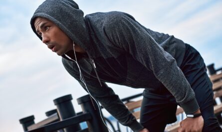 Man wearing a Custom Hoodies Michigan design, showcasing fabric and print quality.