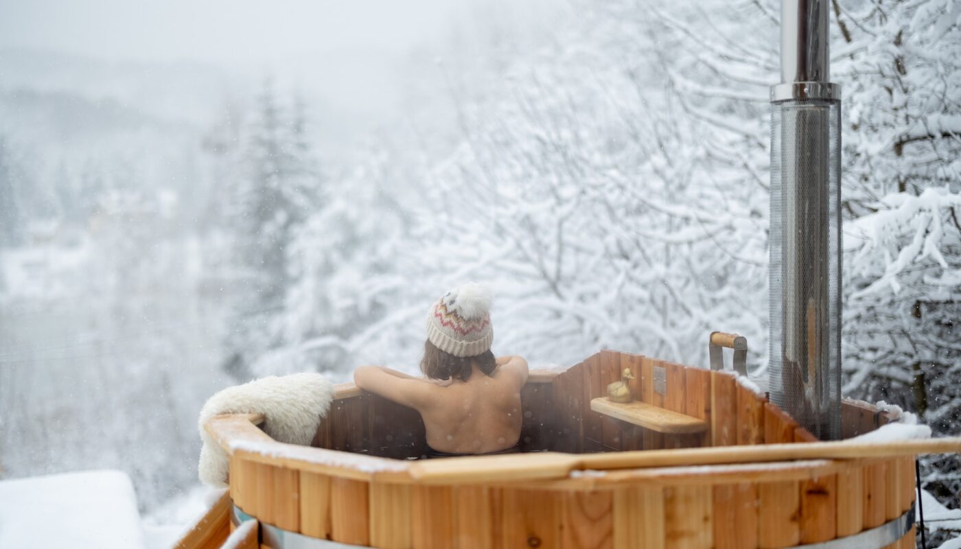 Snowy Michigan backyard with hot tub