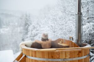 Snowy Michigan backyard with hot tub