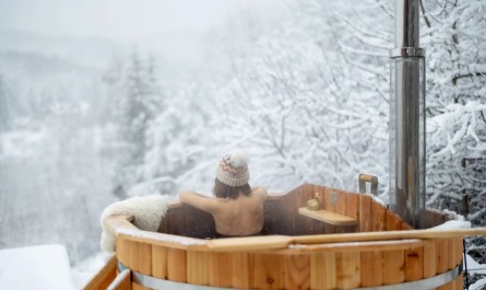 Snowy Michigan backyard with hot tub
