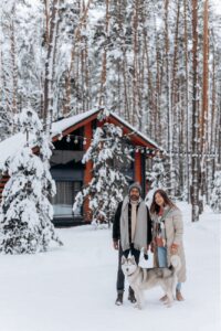 couple with their pet husky