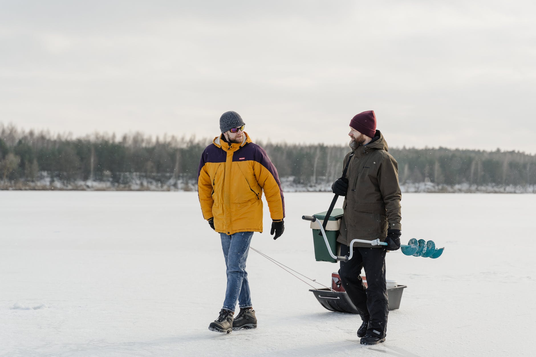 men walking in frozen lake to explore - Saginaw Bay Ice Fishing