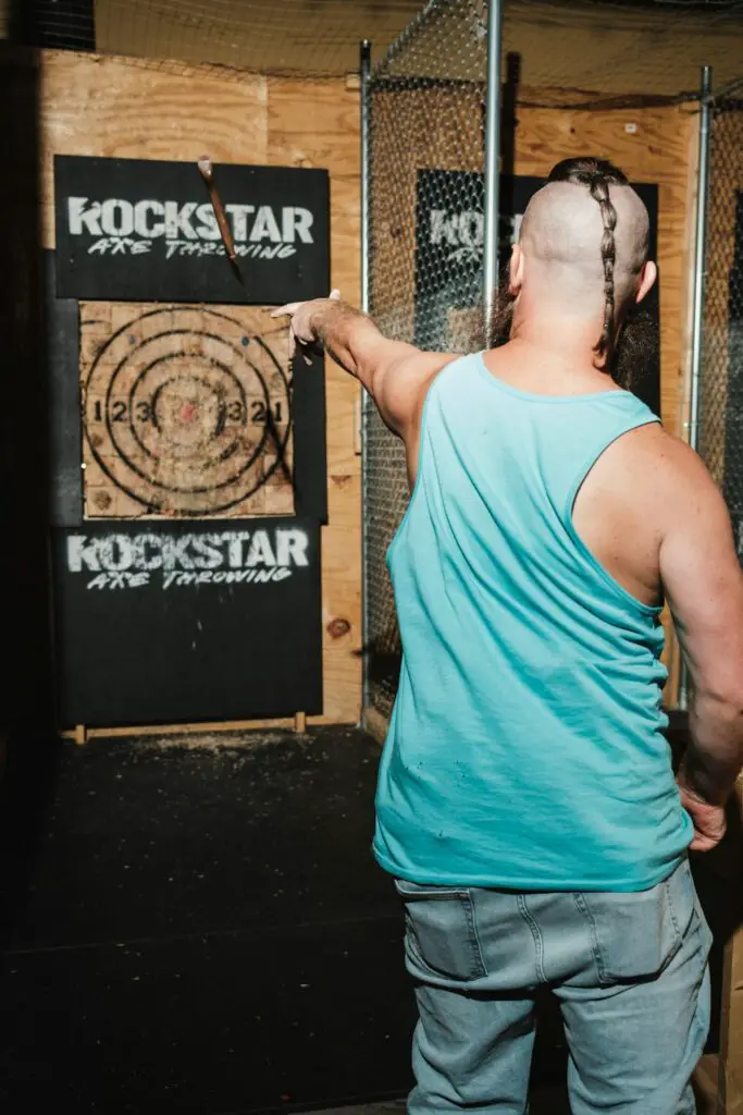 Team members enjoying an axe throwing event