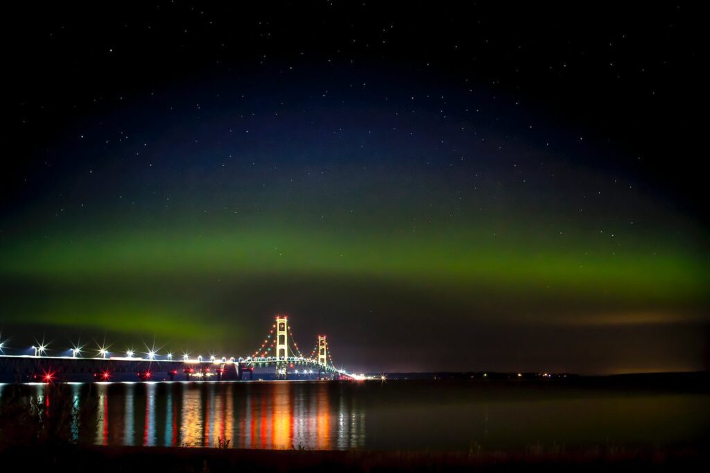 the mackinac bridge under the northern lights