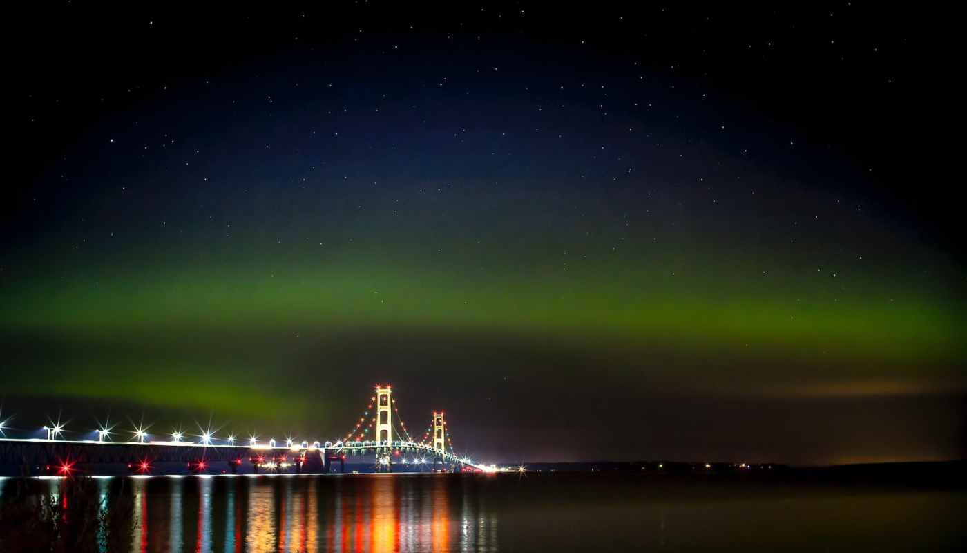 the mackinac bridge under the northern lights