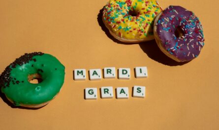 scrabble tiles near doughnuts on yellow surface