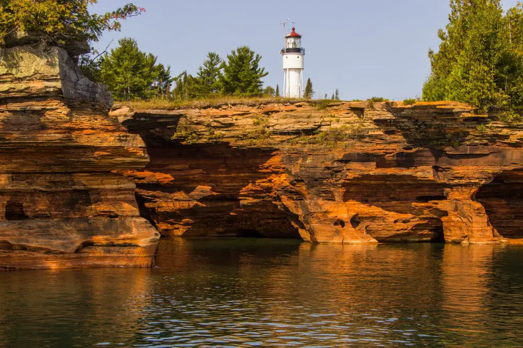 A lighthouse sits on top of devils island of the Apostle Islands in Lake Superior. 
