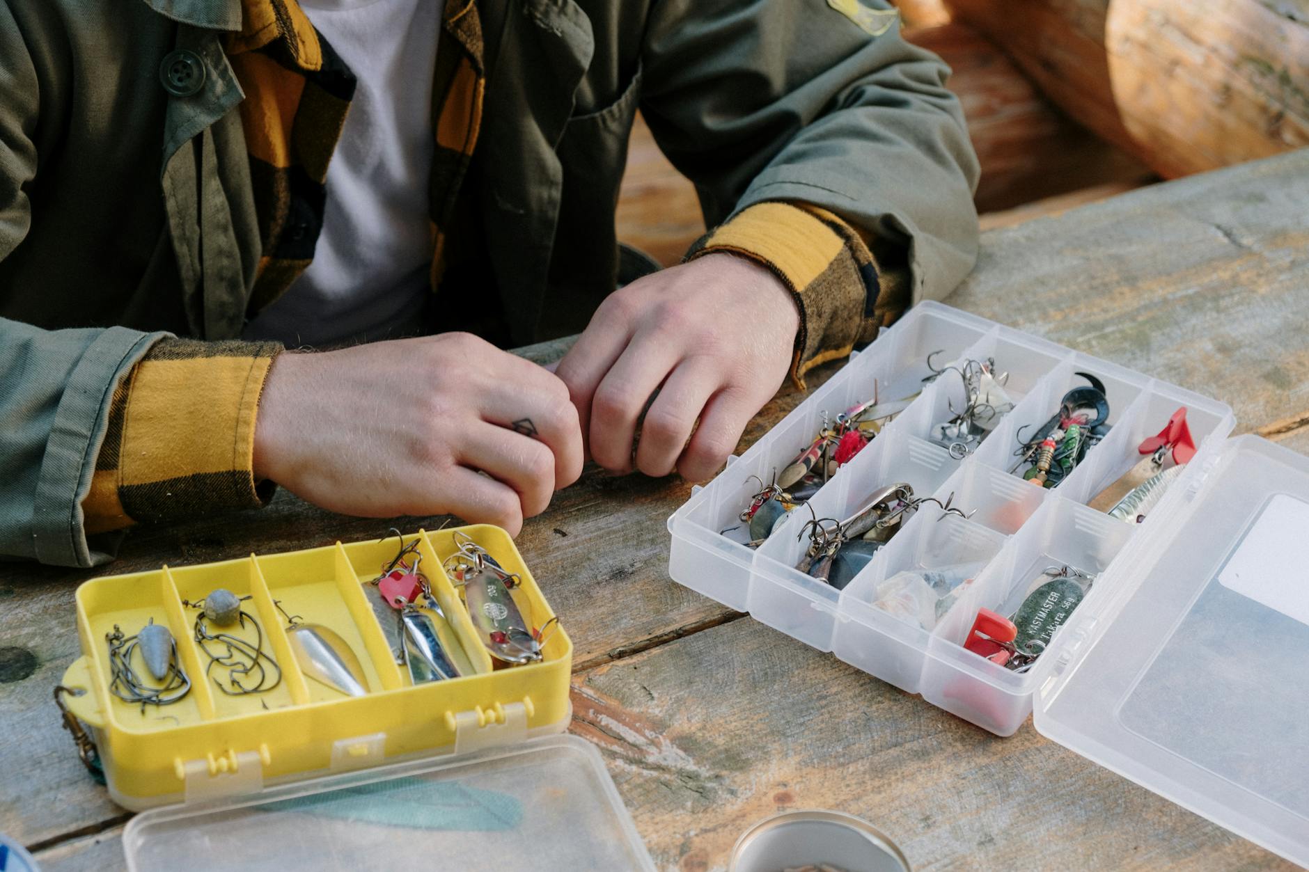 person in gray jacket holding clear plastic container