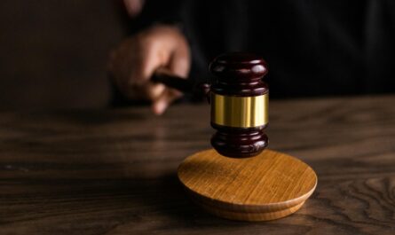 brown wooden gavel on brown wooden table