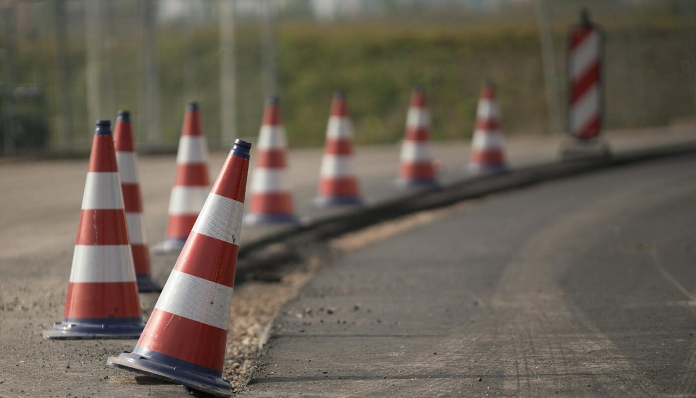 traffic cones in row on road edge