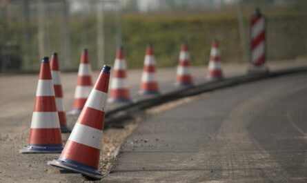 traffic cones in row on road edge