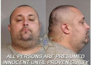 a man with a tattoo on his neck