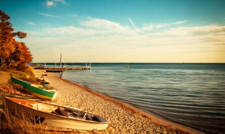 Great Lakes water levels continue their seasonal decline as Michigan experiences warmer-than-average weather. Forecasts predict further drops through November.