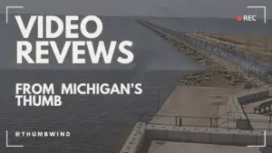 a seawall with a bridge and a body of water