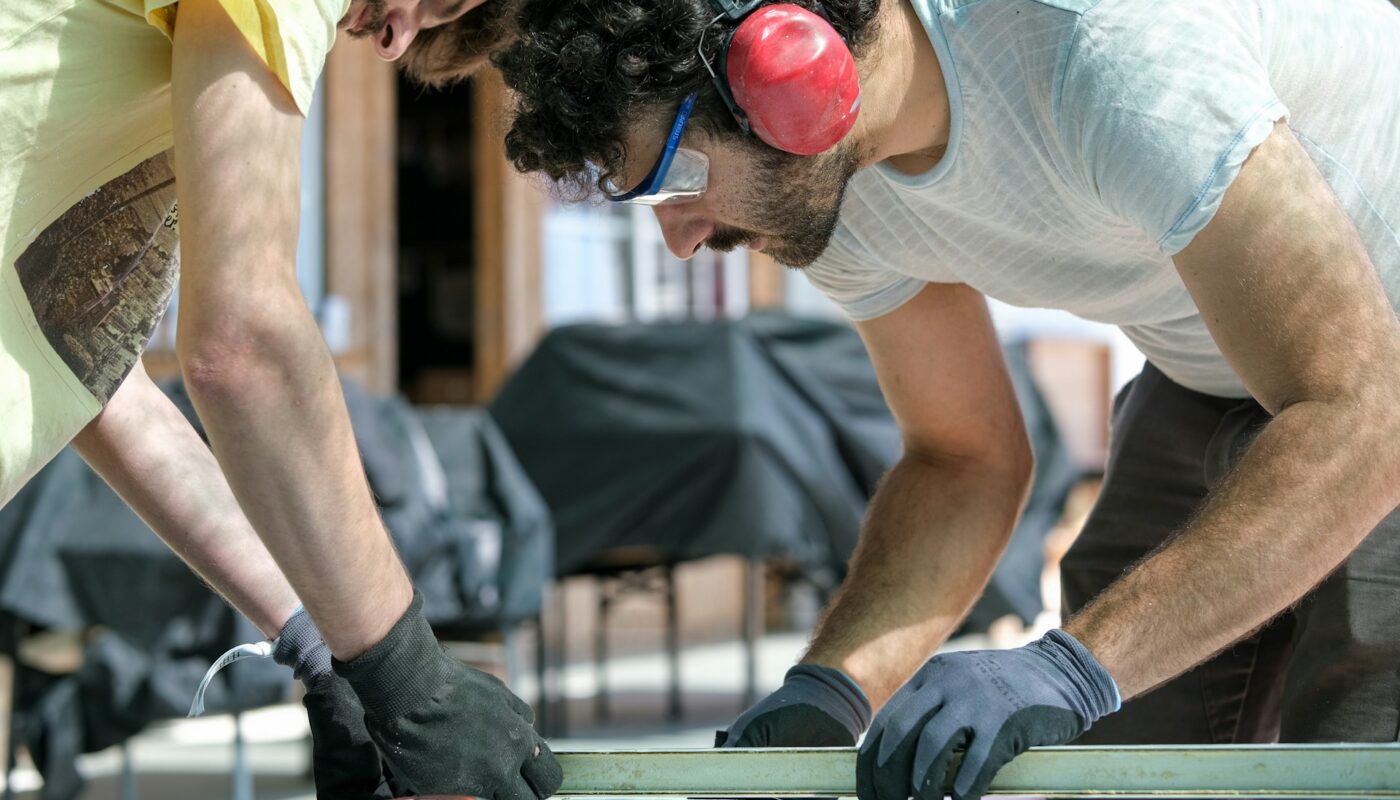 a group of men working on a table