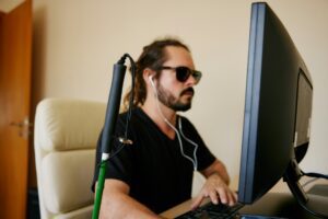 a man sitting in front of a computer