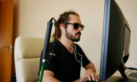 a man sitting in front of a computer