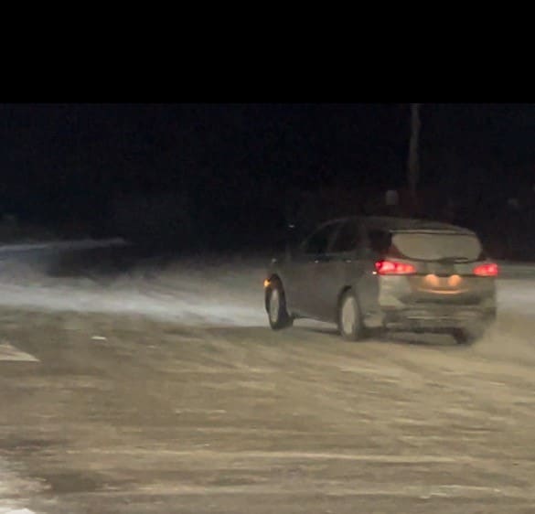 a car driving on a snowy road