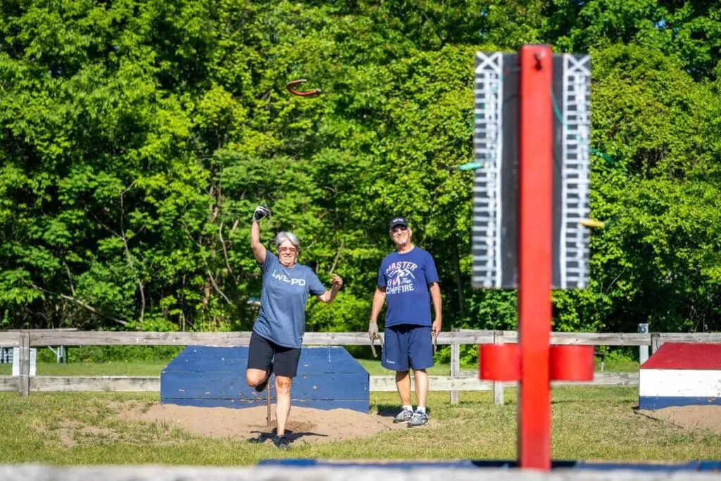 a man and woman playing frisbee