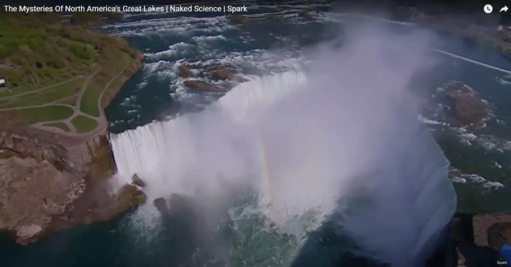 a waterfall with a rainbow