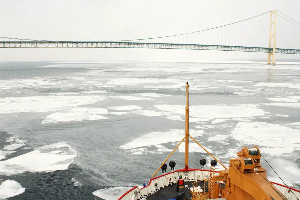 a bridge over water with ice and ice