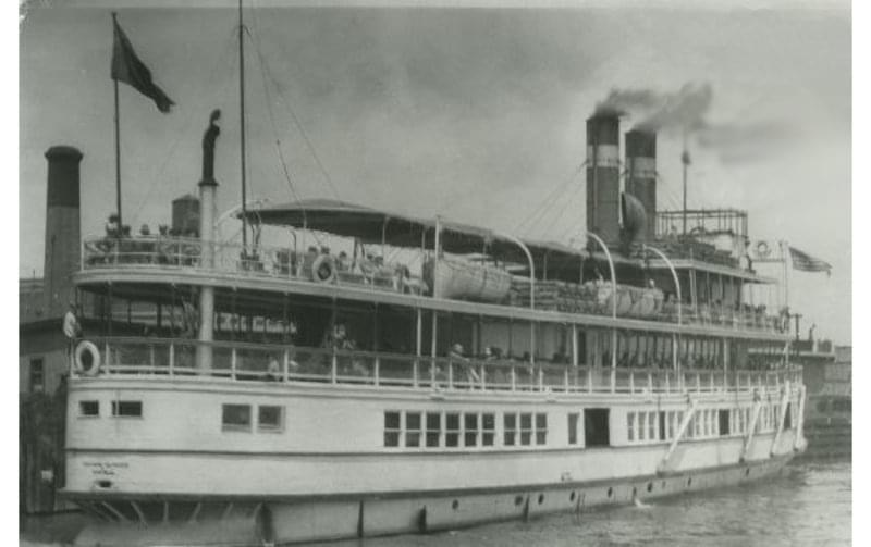 a large boat with smoke stacks