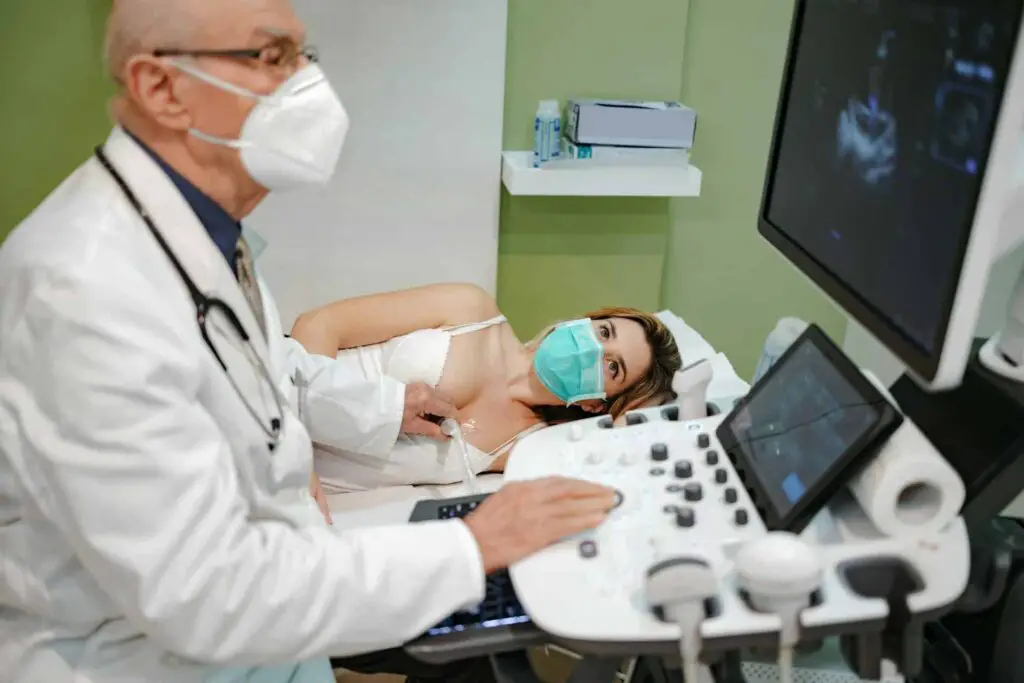 a man in a white coat and a mask looking at a woman lying on a bed