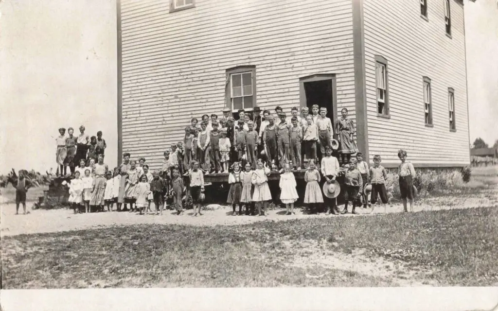 a group of people standing on a porch of a house