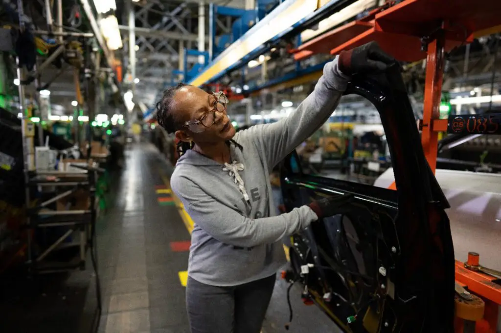 a woman working on a machine